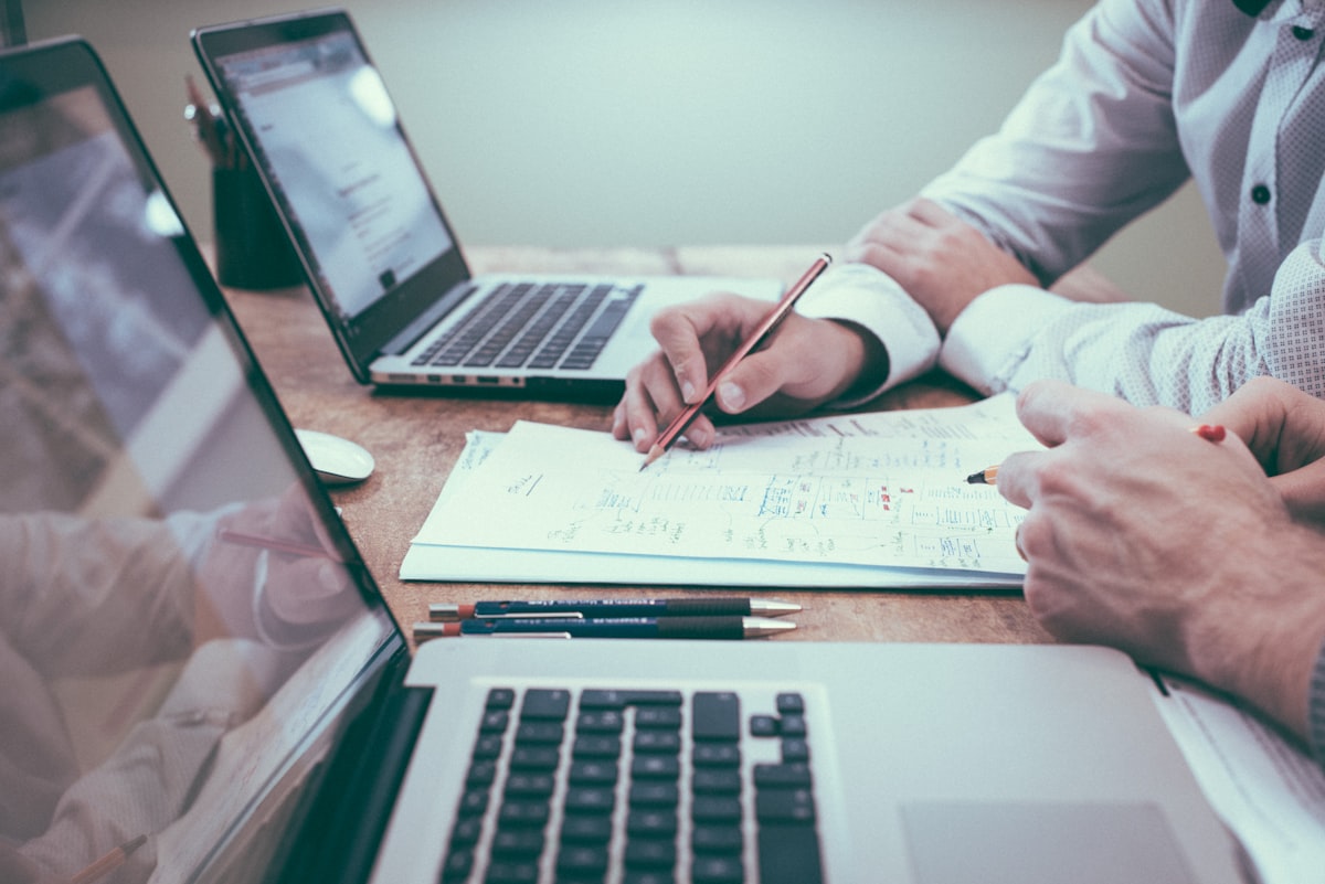 Notebook and laptop during a financial recovery planning review